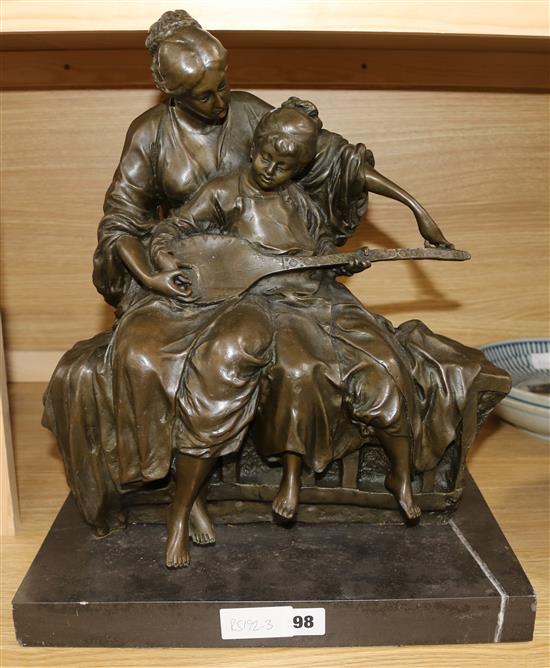 Milo. A bronze group of a mother and child playing a mandolin, on marble plinth, height 44cm